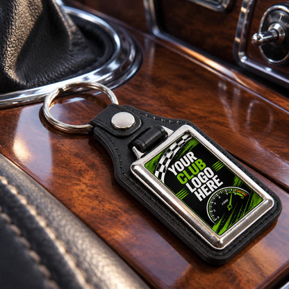 Personalised rectangle leather and metal car club keyring on a classic car centre console.