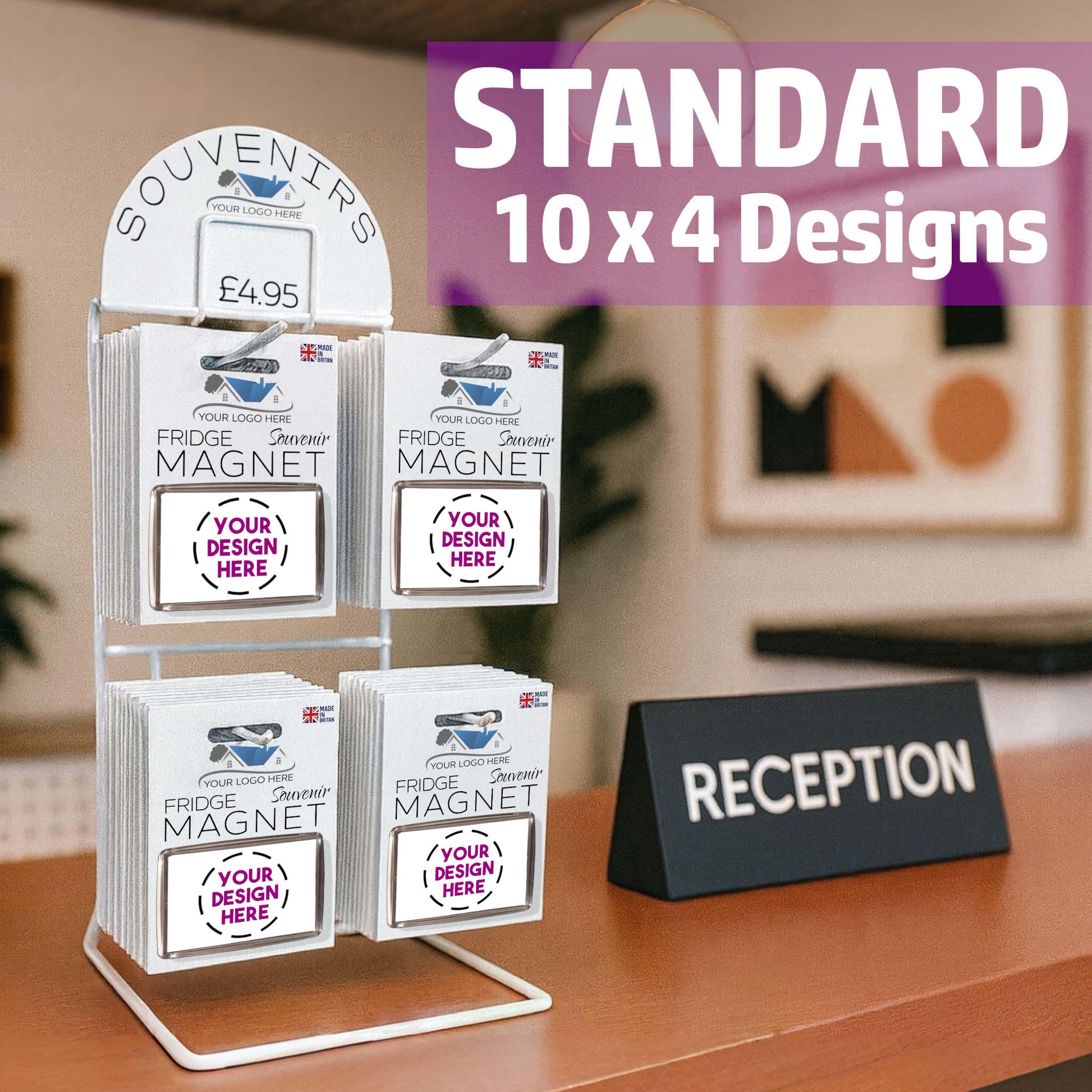 Snazzy Frog Shop in a Box standard display stand placed on a reception desk, featuring souvenir magnets with placeholder packaging and sample logo designs.